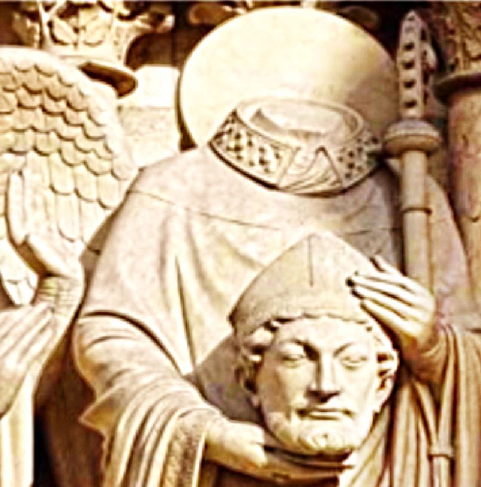 รูปปั้นนักบุญเดนิสหิ้วหัว มักยืนอยู่ตามหน้าบันมหาวิหารในปารีส