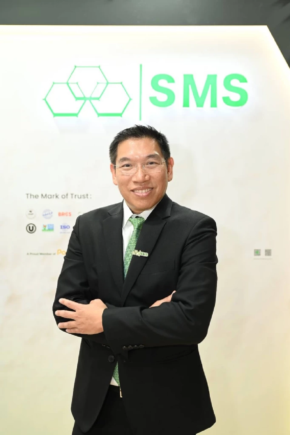 นายเขม หวั่งหลี กรรมการผู้จัดการ บริษัท เอสเอ็มเอส คอร์ปอเรชั่น จำกัด 
